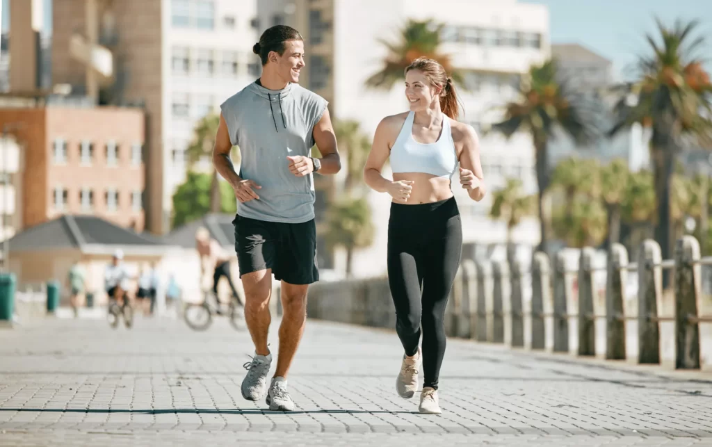 couple running and training together in the city utc