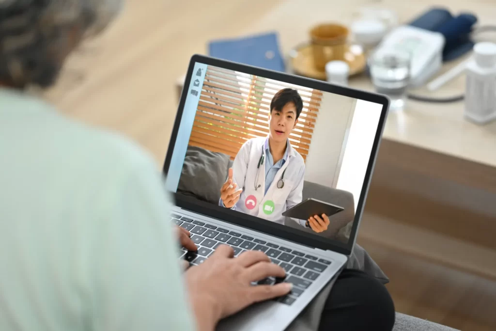 senior woman in telemedicine appointment with doct utc
